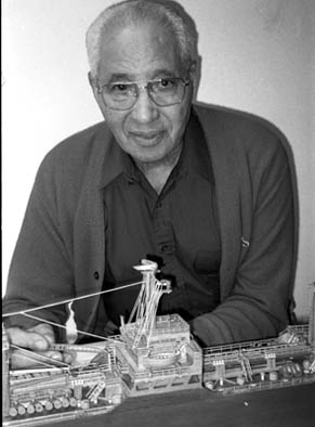 Aniceto Giilmette posing with the Exxon Lightship, Full-hull ship model, 2001; Aniceto Gilmette; New Bedford, Massachusetts; Wood, string; Photography by Laura Orleans