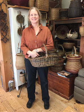 Wendy Jensen holding one of her willow baskets, Basketmaking, 2016; Wendy G Jensen; Monterey, Massachusetts; Willow; Photography by Maggie Holtzberg