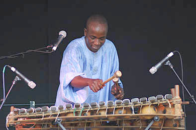 Balla Kouyaté with balafon. Photography by Alison Williams., Malian musician, 2007; Balla Kouyaté (b. 1973); Medford, Massachusetts;