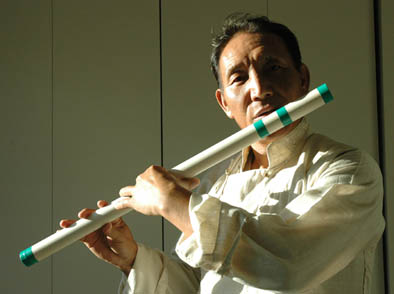 Penpa Tsering playing the tyling, Tibetan musician, 2014; Penpa Tsering (b. 1963); Bedford, Massachusetts; Photography by Maggie Holtzberg